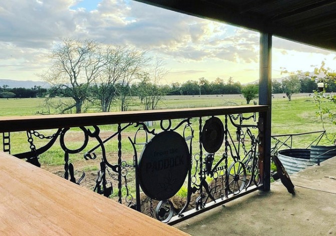 Looking over the paddocks from the covered rustic verandah in From the paddock cafe to the Glen Davis Gorge.