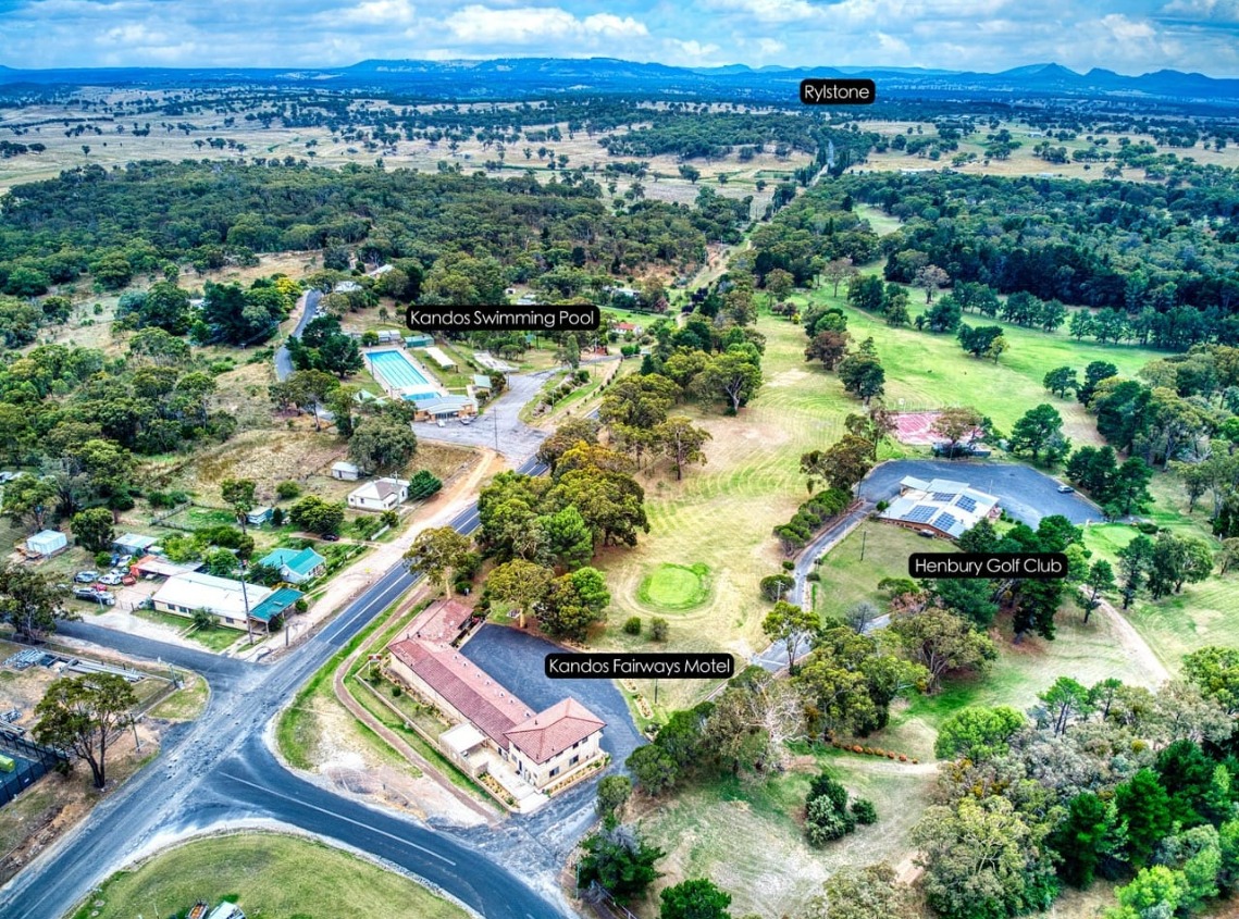Birds eye street view of Kandos Fairways motel and its position in relation to main attractions of Kandos, including the swimming pool top left, Henbury golf club top right and Motel bottom of picture.